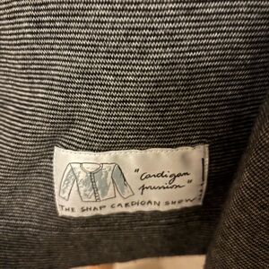 Agnès b cardigan in black and grey stripes with logo in the back